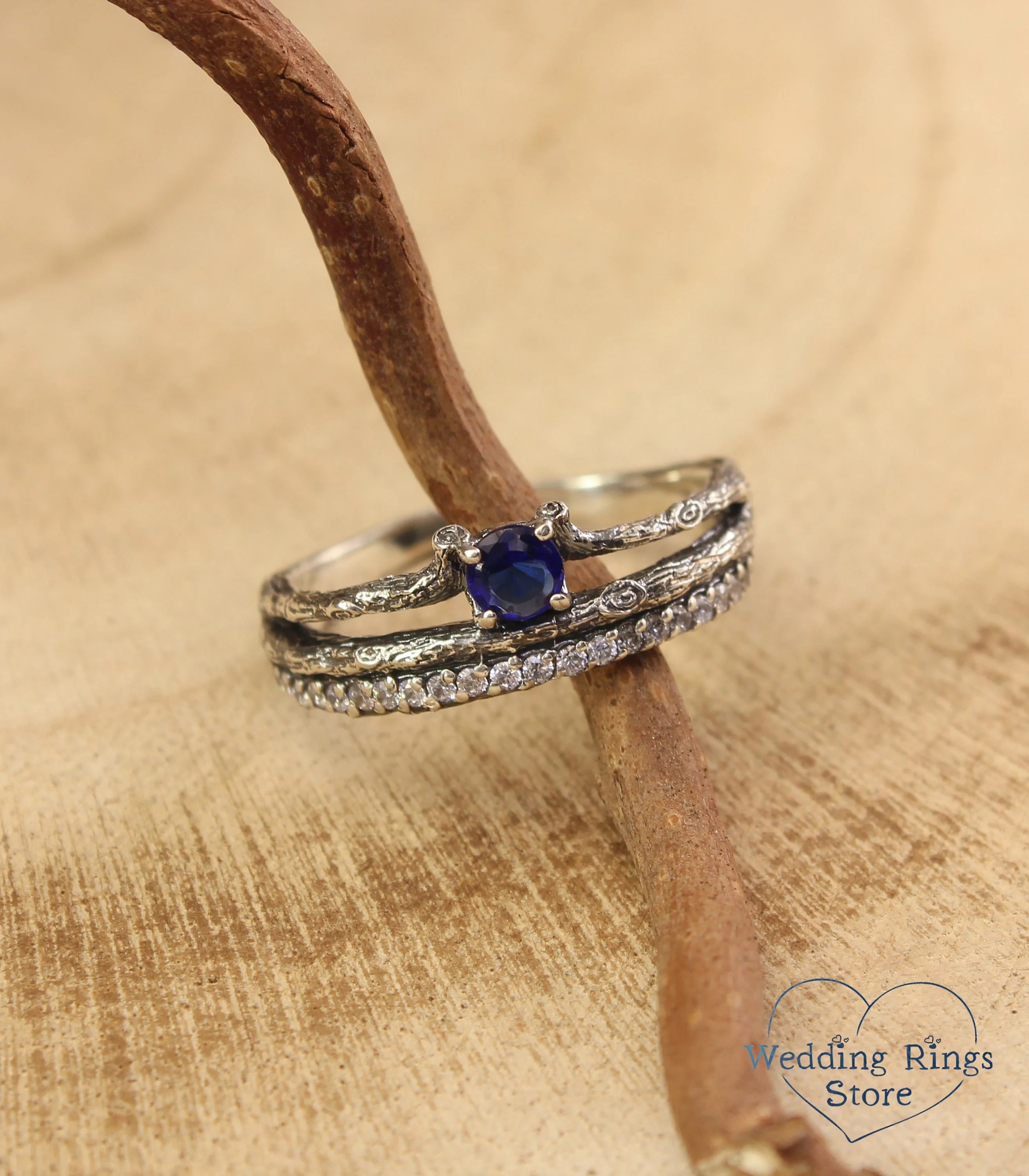 Split shank Silver Sapphire Engagement Ring with Side Stones on Twig